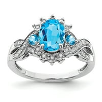 Prsten od čistog srebra s dijamantom i plavim topazom. Karatna težina je 0,15 karata. Težina dragulja - 1,35 karata